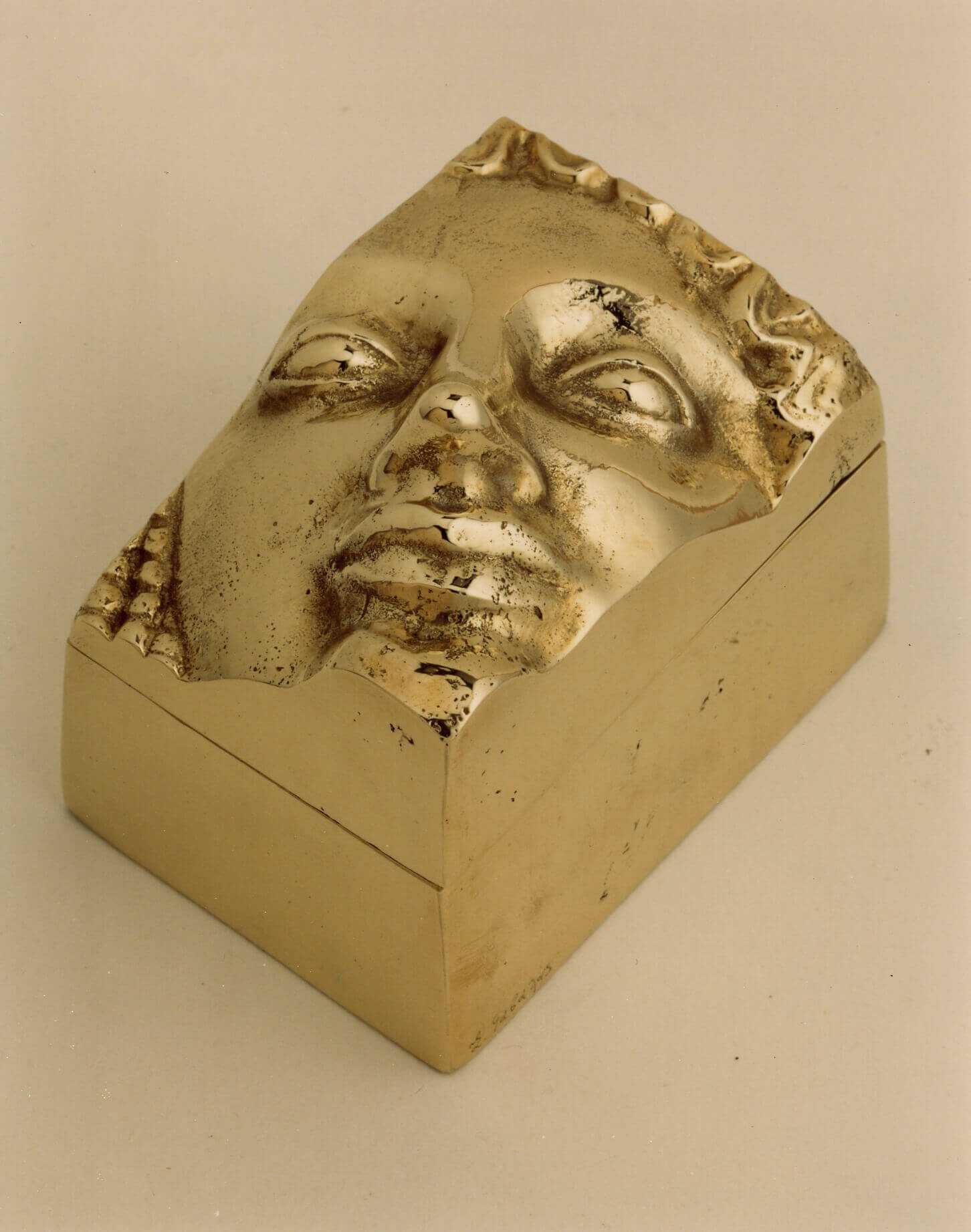 Stelios Gavalas aluminium box sculpture of a Kouros statue face.