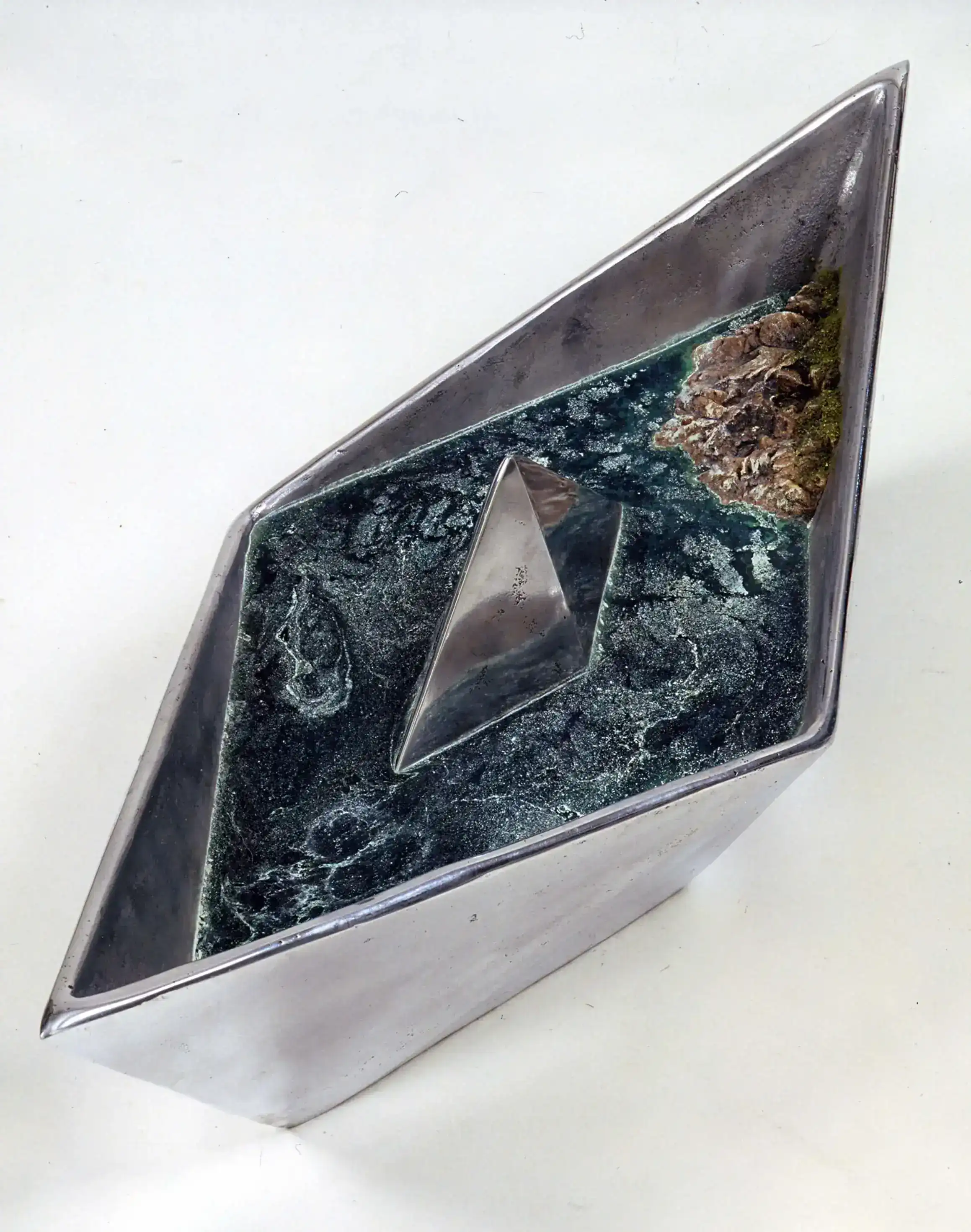 Stelios Gavalas sculpture from aluminium boats with and island and rough sea water - 1.
