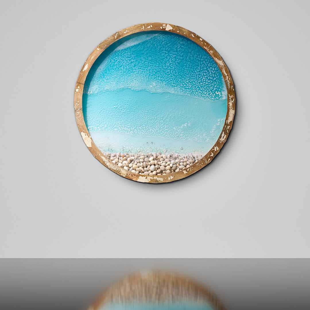 Stelios Gavalas Sculpture: Beach with sand and pebbles and variations of blue water in circular frame.