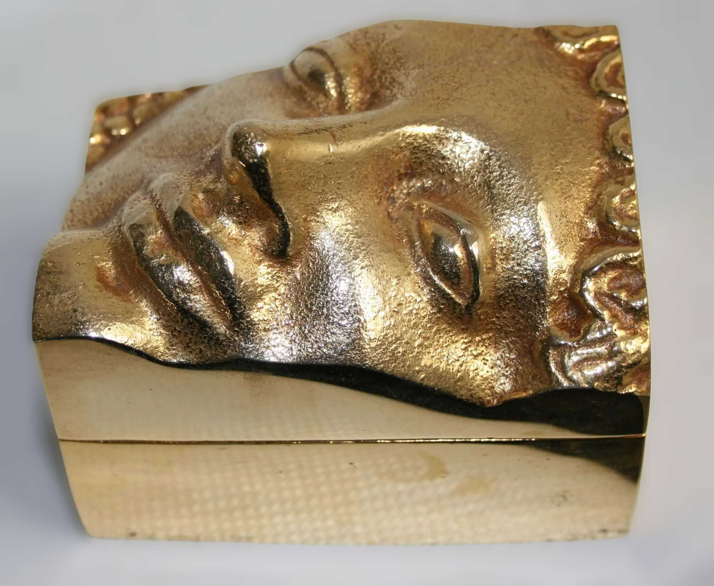 Stelios Gavalas aluminium box box sculpture of a Kouros's face.