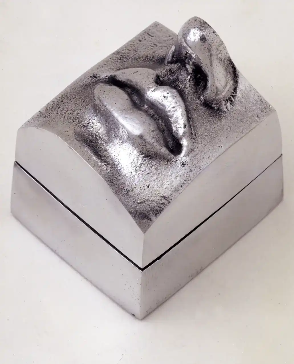 Stelios Gavalas aluminium box sculpture of a silver face of ancient Greek statue.